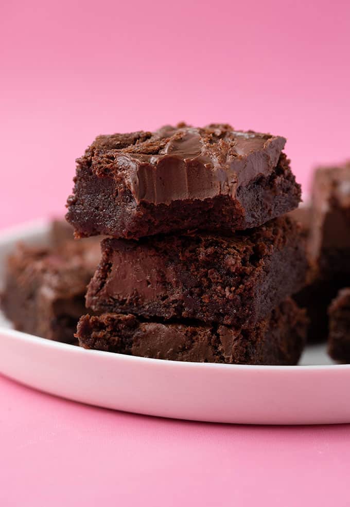 A stack of homemade Nutella Brownies with a bite taken out of it