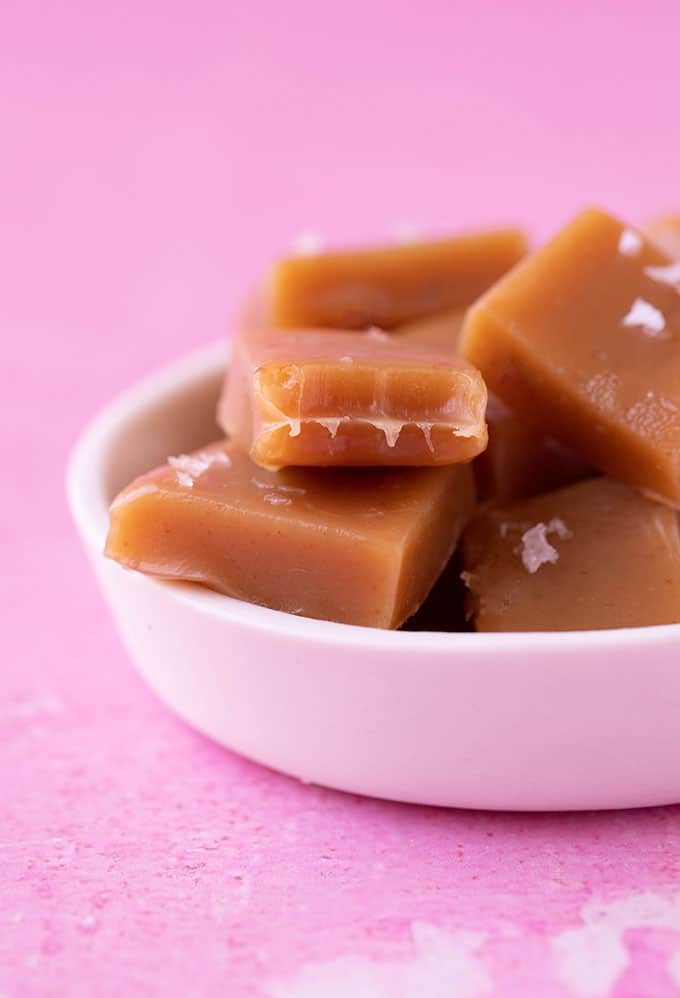 A white bowl full of homemade Salty Caramel Candy