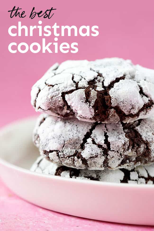 A stack of Chocolate Crinkle Cookies on a pink background