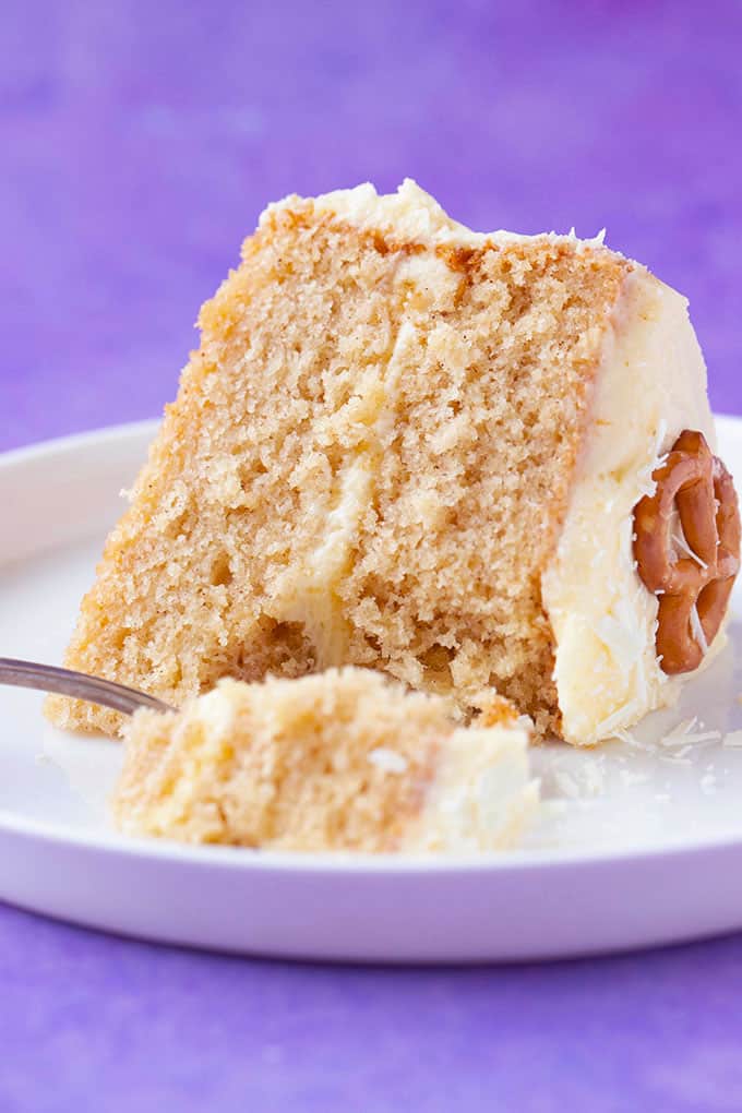 A slice of Eggnog Cake with a bite taken out of it 