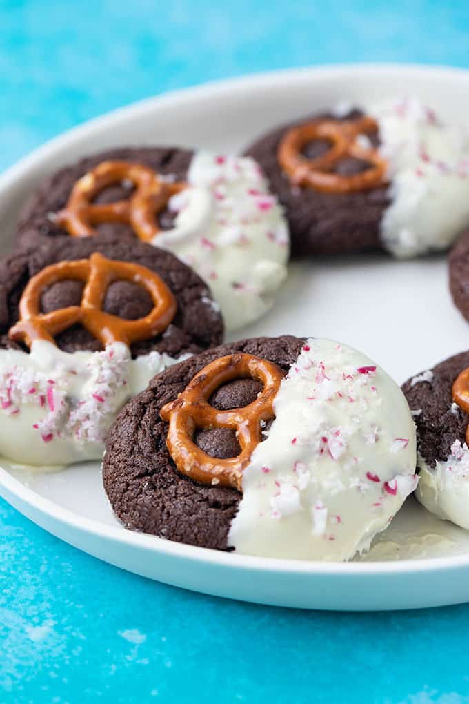 A close up of plate of chocolate dipped Pretzel Cookies