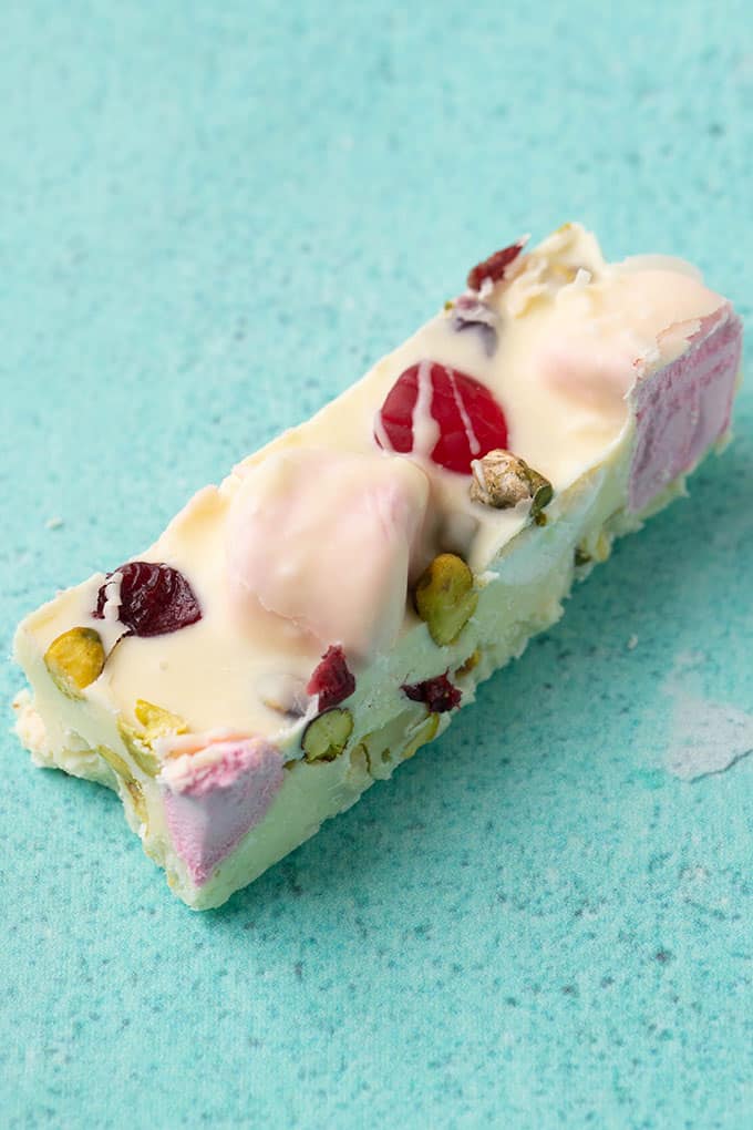 A piece of White Chocolate Rocky Road on a green background