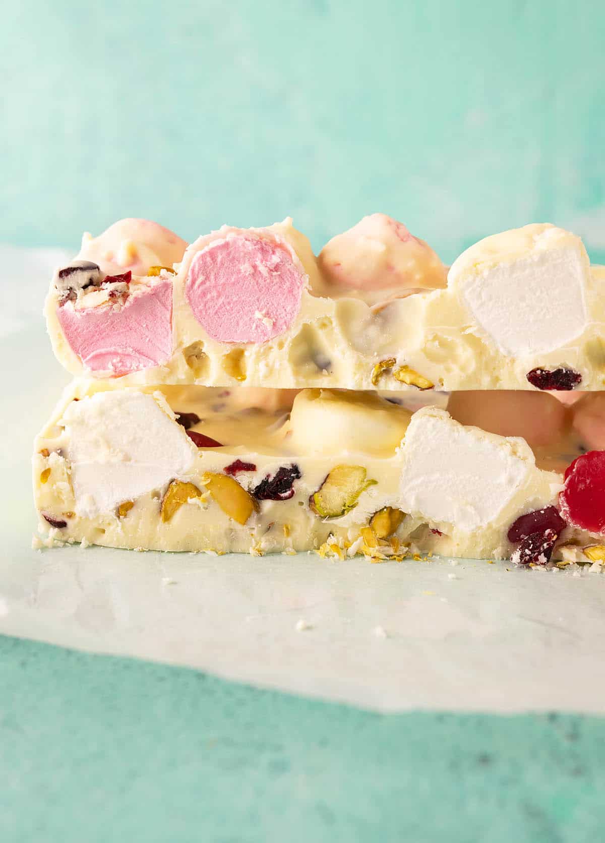 Beautiful homemade White Chocolate Rocky Road on a green backdrop. 