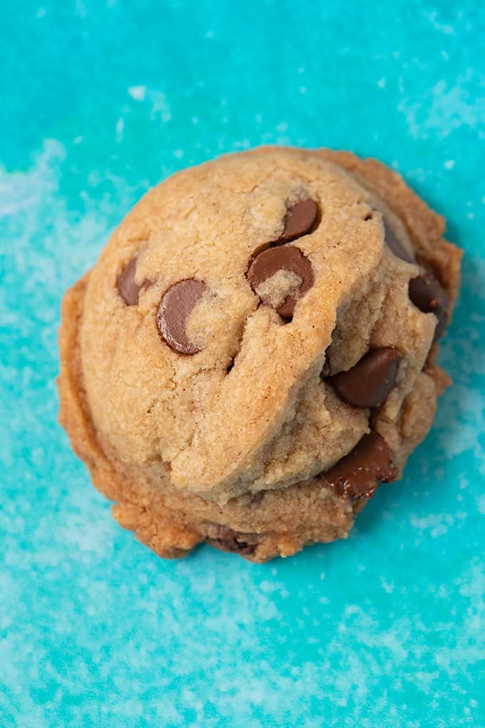 Top view of a Vegan Chocolate Chip Cookie on a turquoise background