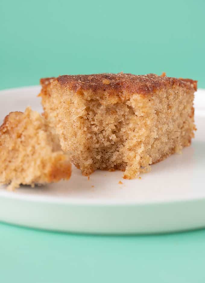 A piece of Cinnamon Tea Cake with a bite taken out of it