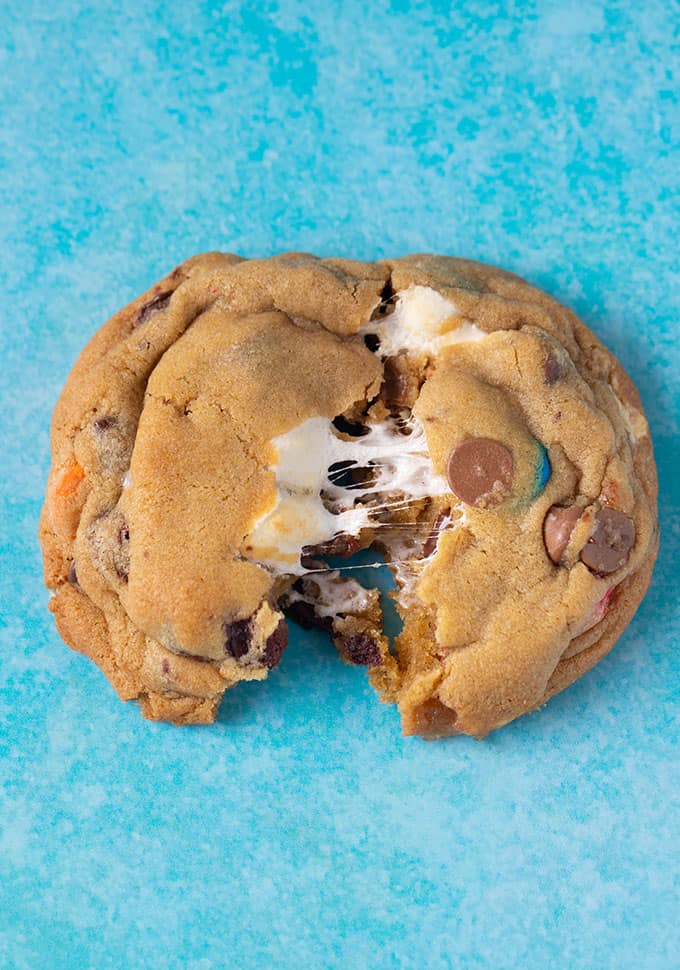 Top view of a M&M marshmallow cookie torn in half