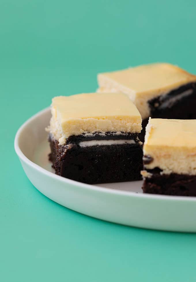 A side view of a cheesecake brownie with an Oreo hiding in the middle