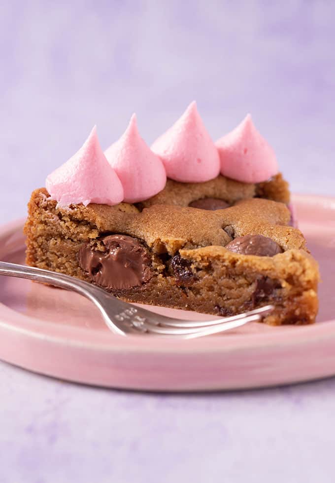 A slice of Easter Egg Cookie Cake on a pink plate