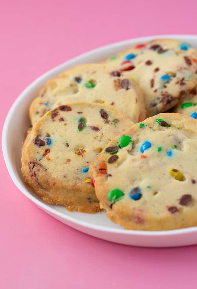 A plate of homemade Shortbread Cookies filled with colourful M&M's