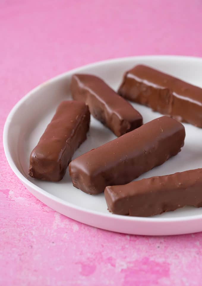 A white plate filled with homemade Twix Bars