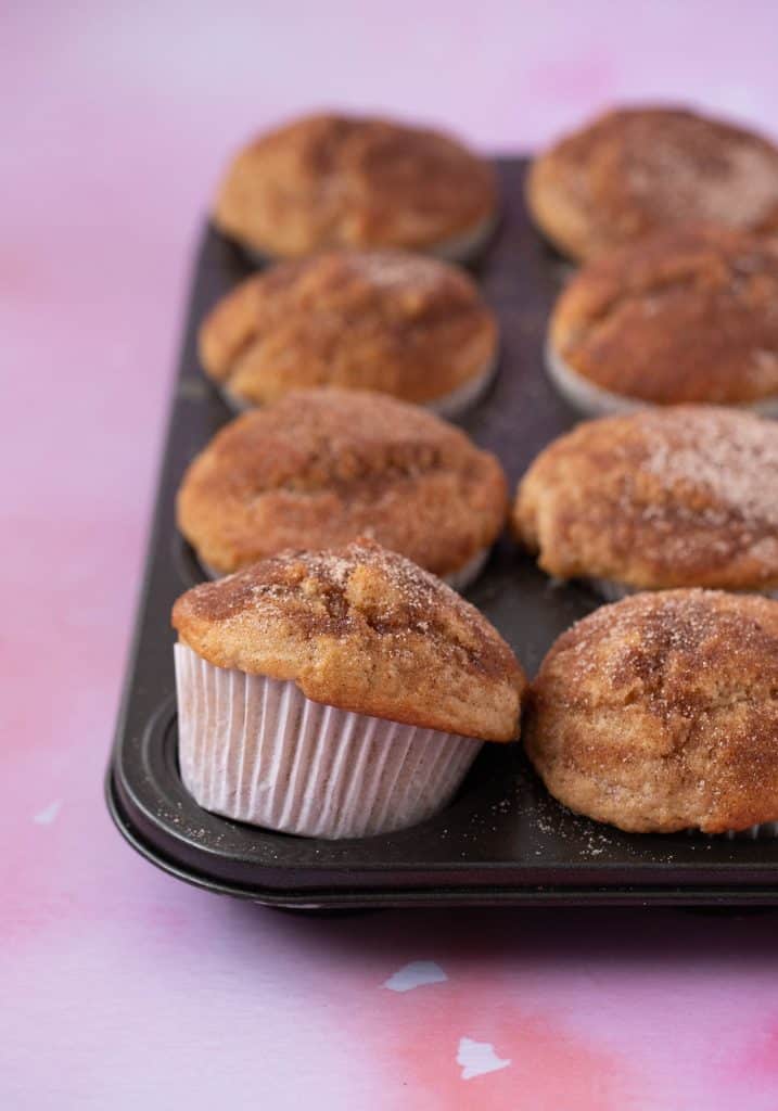 A batch of homemade Cinnamon Donut Muffins fresh from the oven.