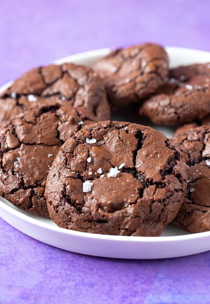 A plate of homemade Brownie Cookies on a purple background