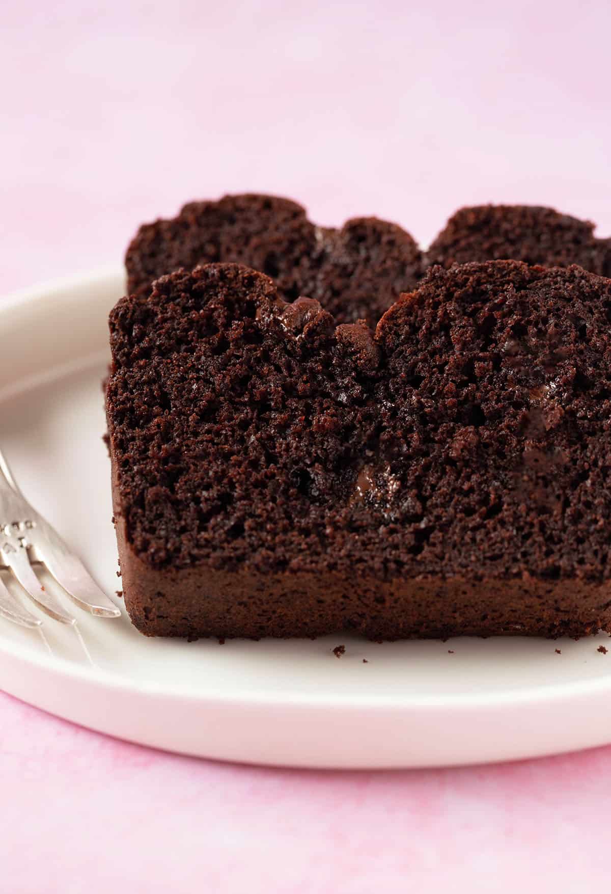 Thick cut slices of Chocolate Bread on a white plate. 