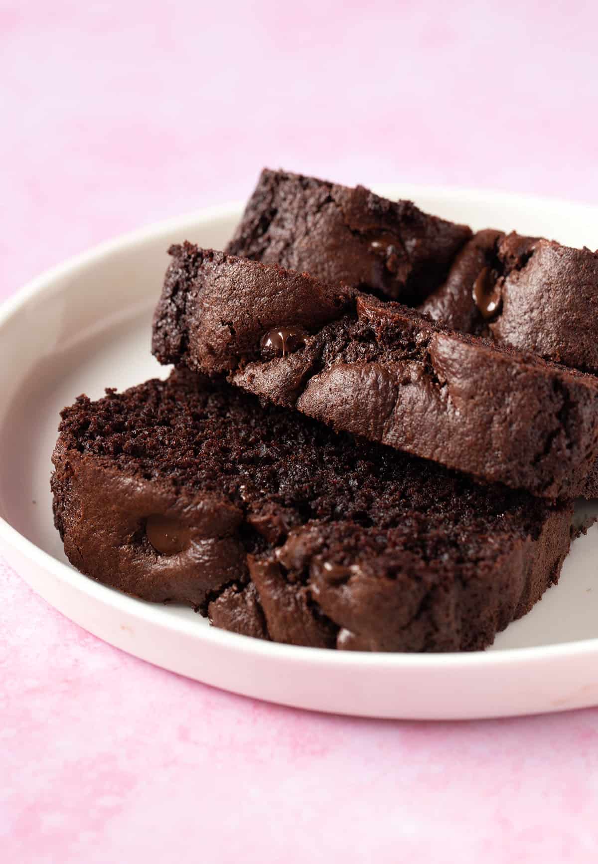 Thick slices of Chocolate Bread on a white plate. 