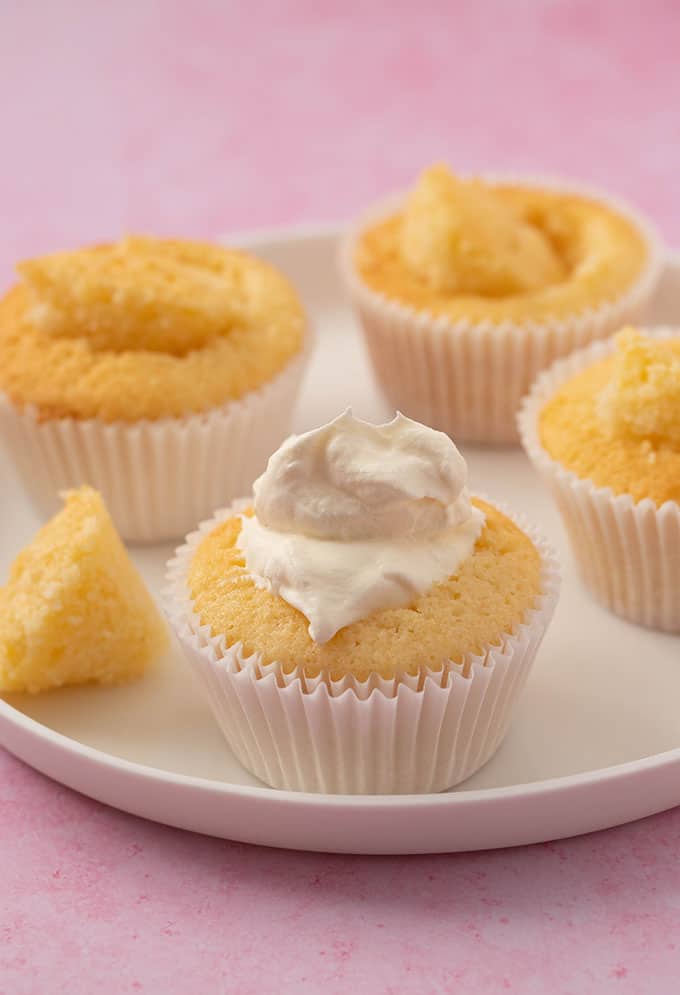 A homemade vanilla cupcake filled with whipped cream