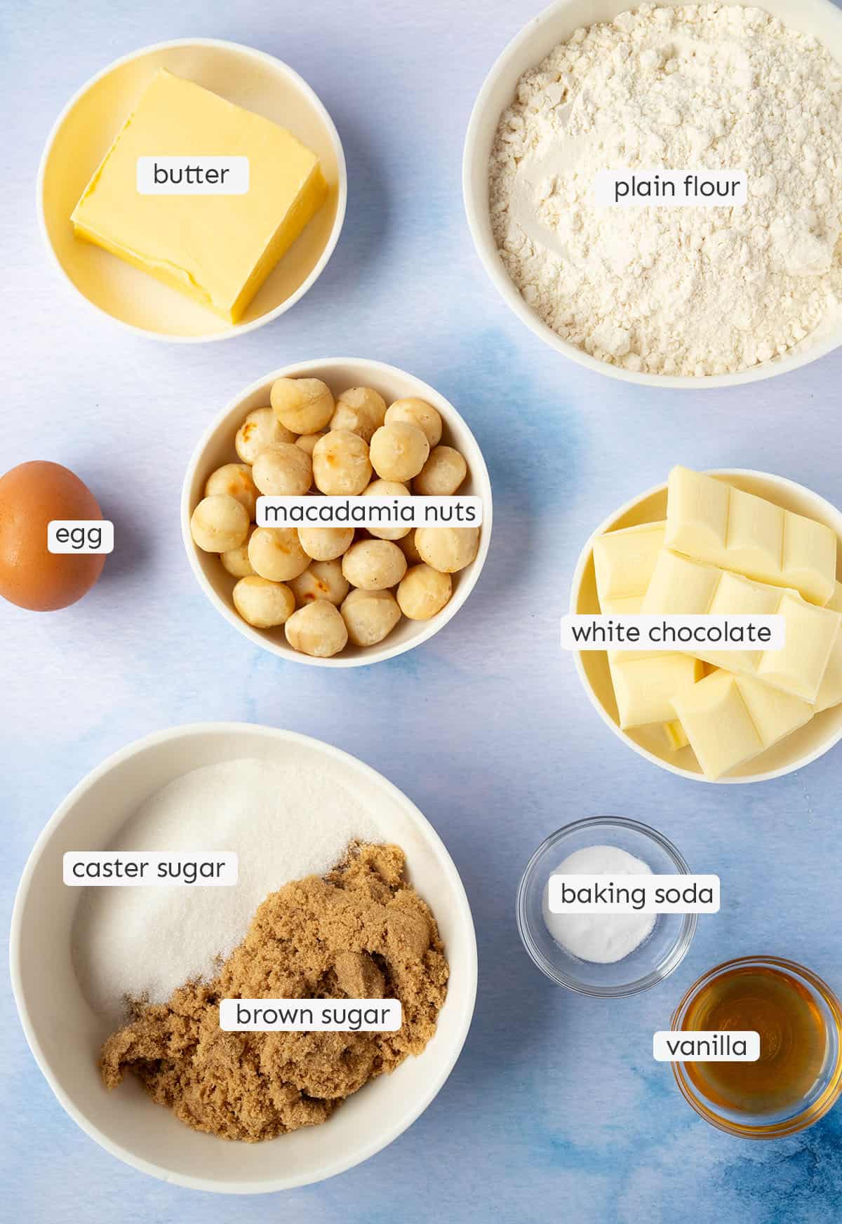 All the ingredients needed to make white chocolate macadamia cookies from scratch.