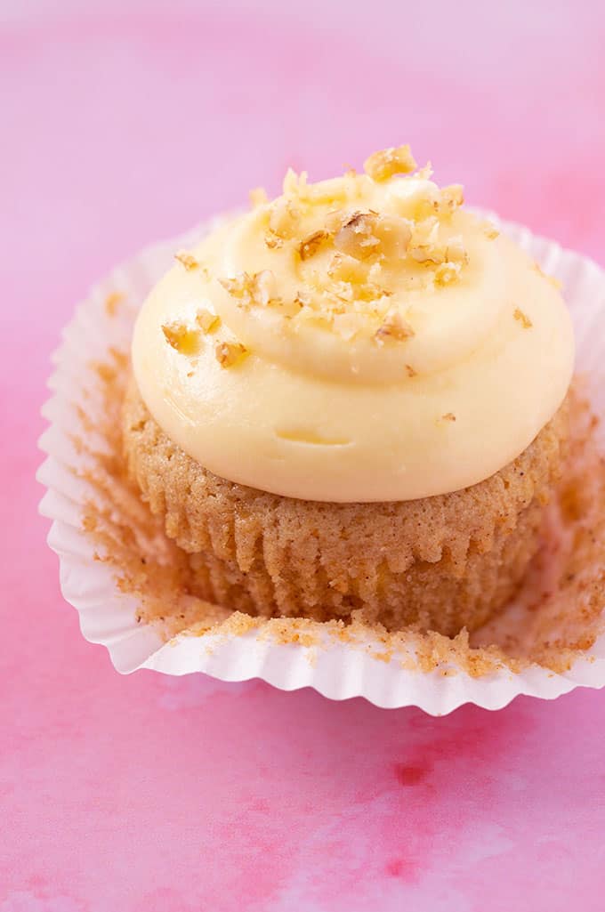 Close up of a Banana Cupcake topped with cream cheese frosting