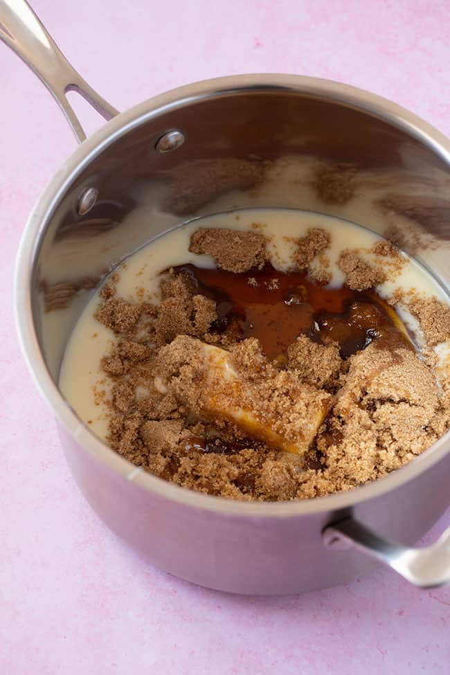 A saucepan filled with condensed milk, molasses, brown sugar and butter