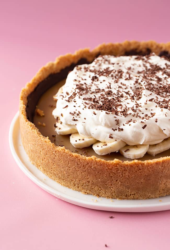Banoffee Pie decorated with whipped cream and chocolate shavings