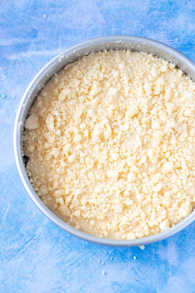 Top view of a cake pan filled with cake batter ready to go into the oven