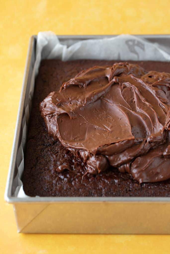 A chocolate orange sheet cake covered in choc frosting