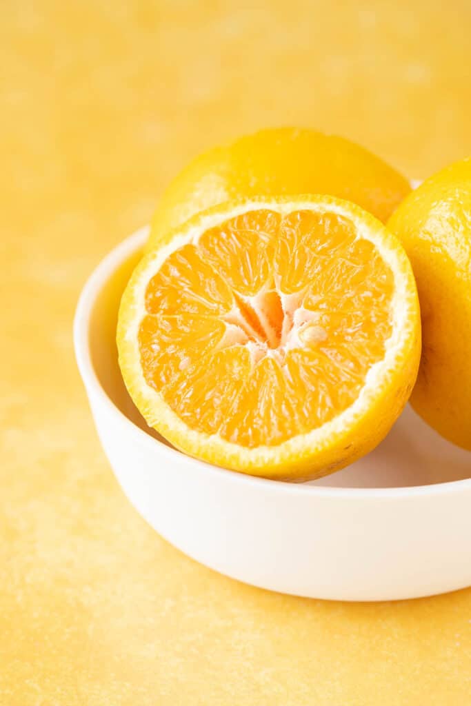 A fresh orange on an orange background 