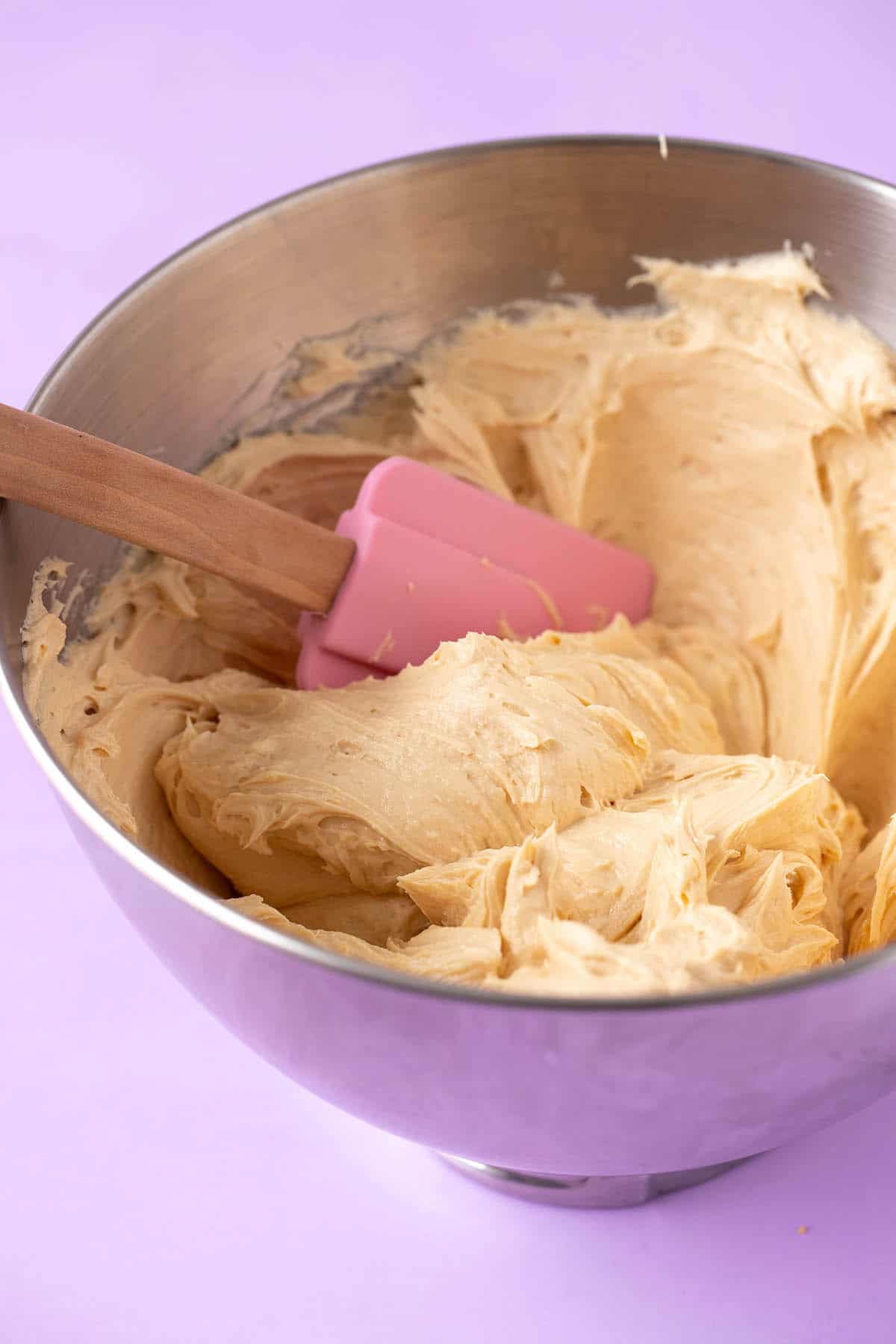 A mixing bowl filled with creamy peanut butter filling