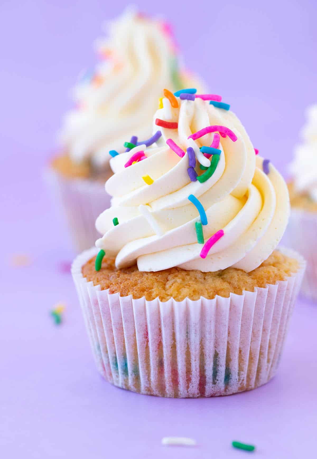 A close up of a beautiful funfetti cupcake.
