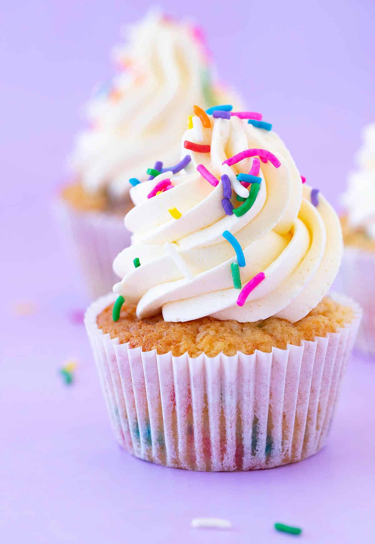 Funfetti Cupcakes decorated with swirls of buttercream. 