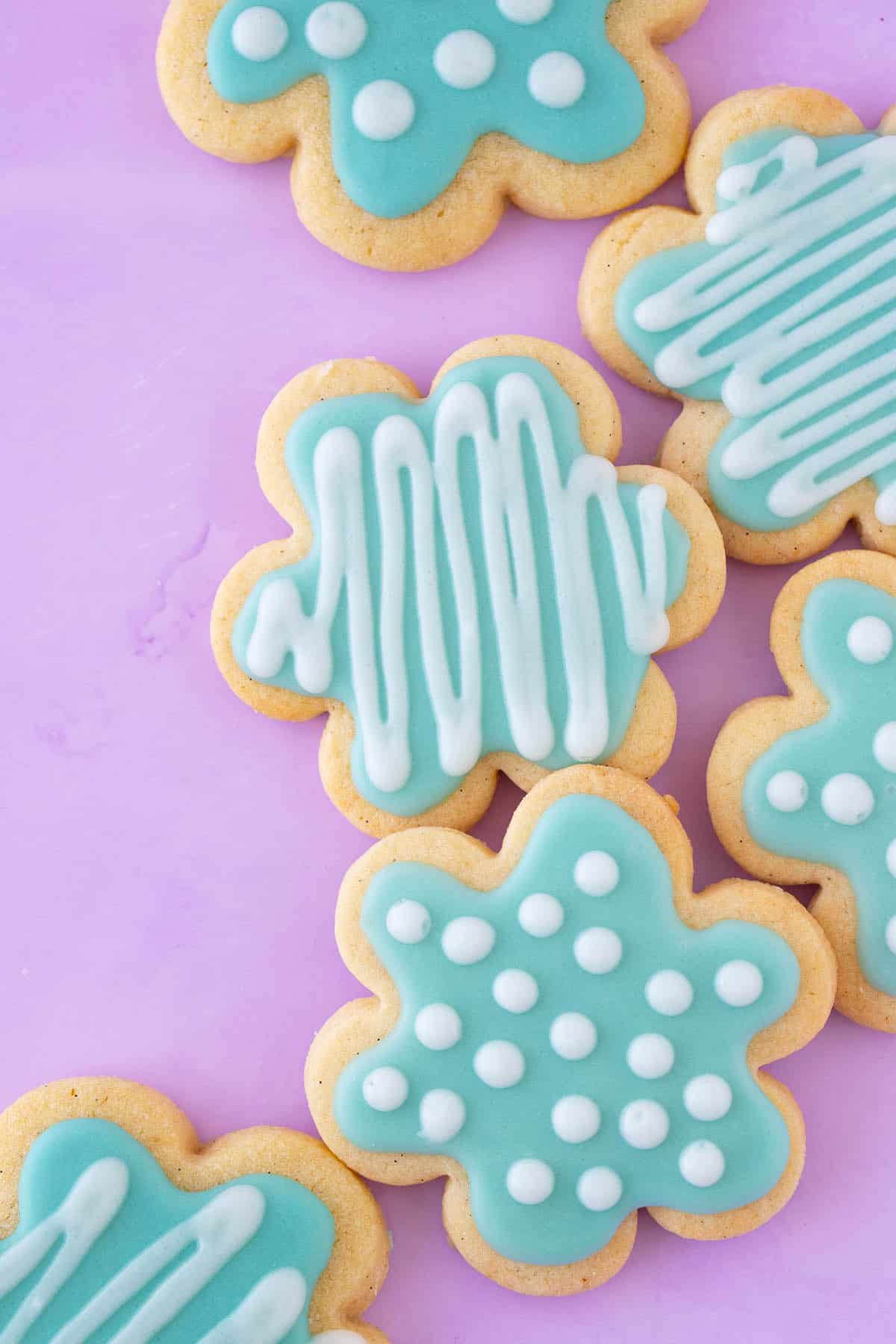 Handmade Sugar Cookies on a purple background.
