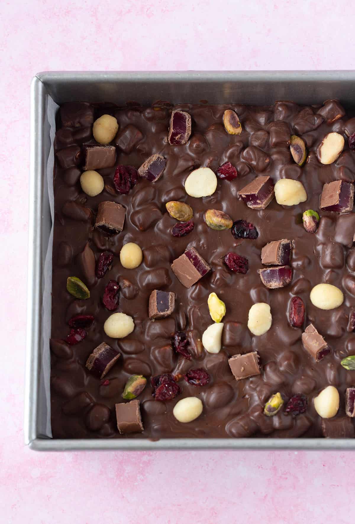 Top view of a slab of Christmas Rocky Road in a baking pan.