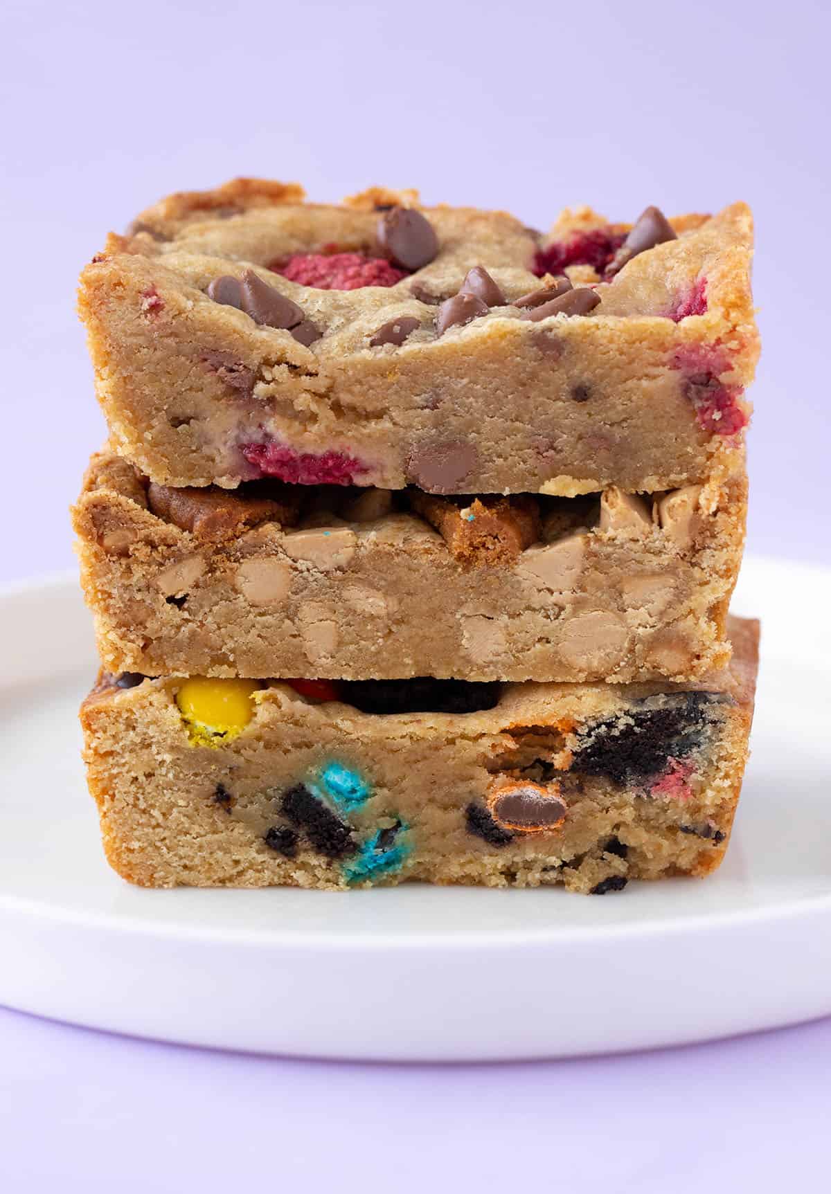 A tall stack of homemade blondies in myriad of flavours