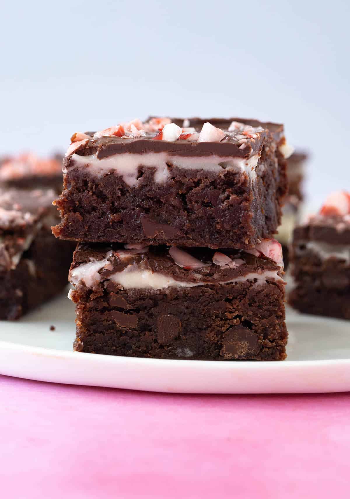 A stack of Peppermint Brownies on a white plate.