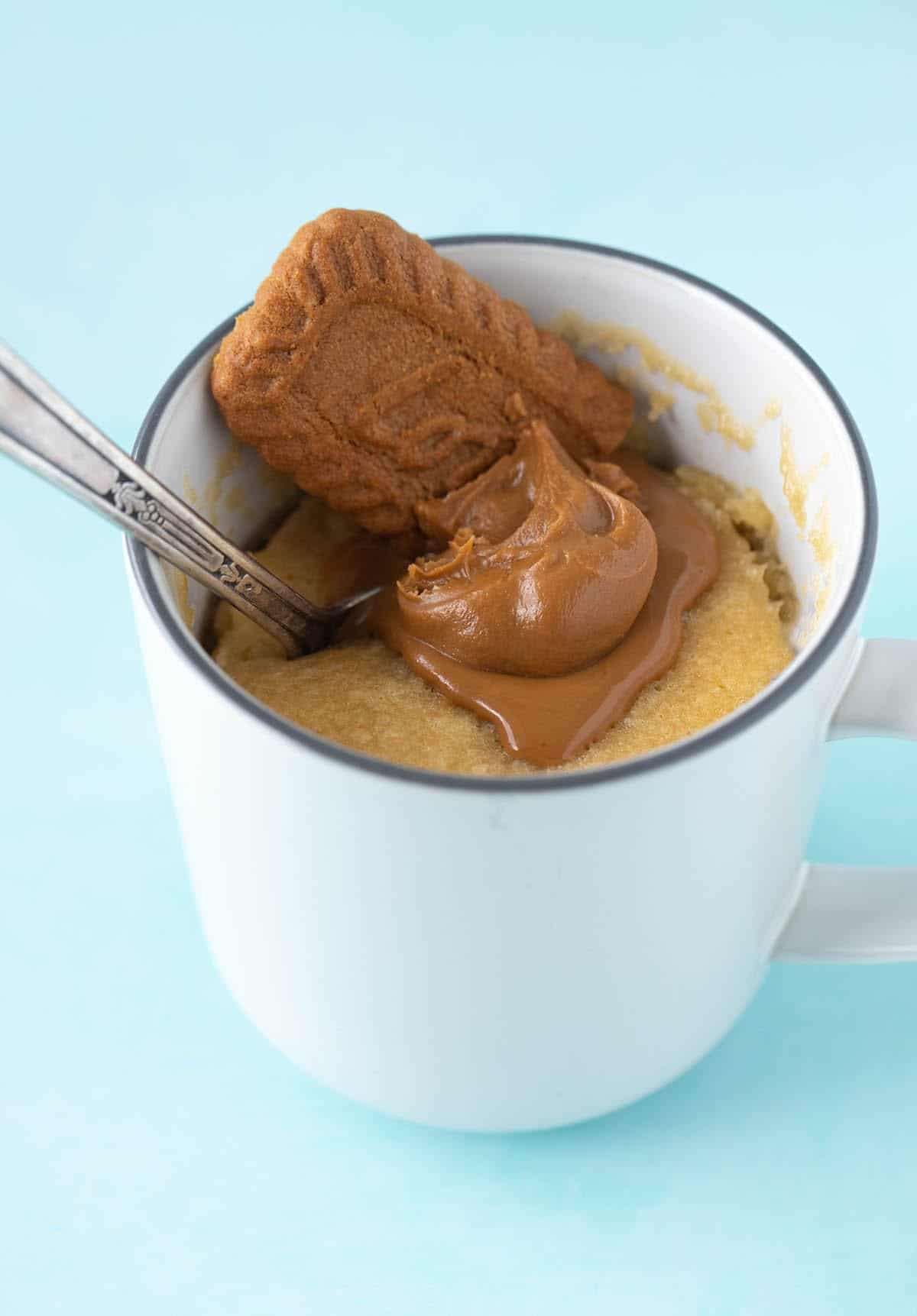 Gooey Biscoff Mug Cake topped with Lotus Biscoff Cookies