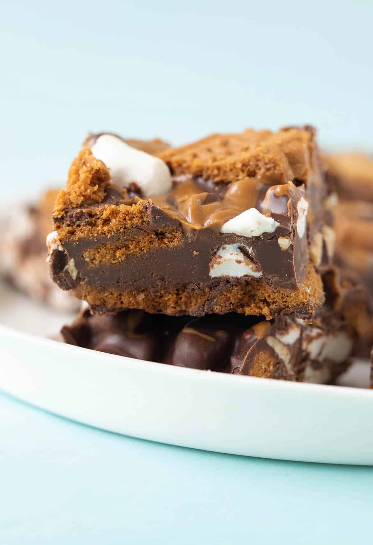 Two pieces of Biscoff Rocky Road on a white plate.