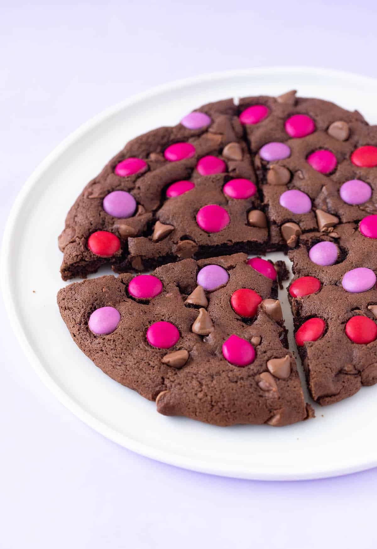 A beautiful chocolate cookie cut into slices.