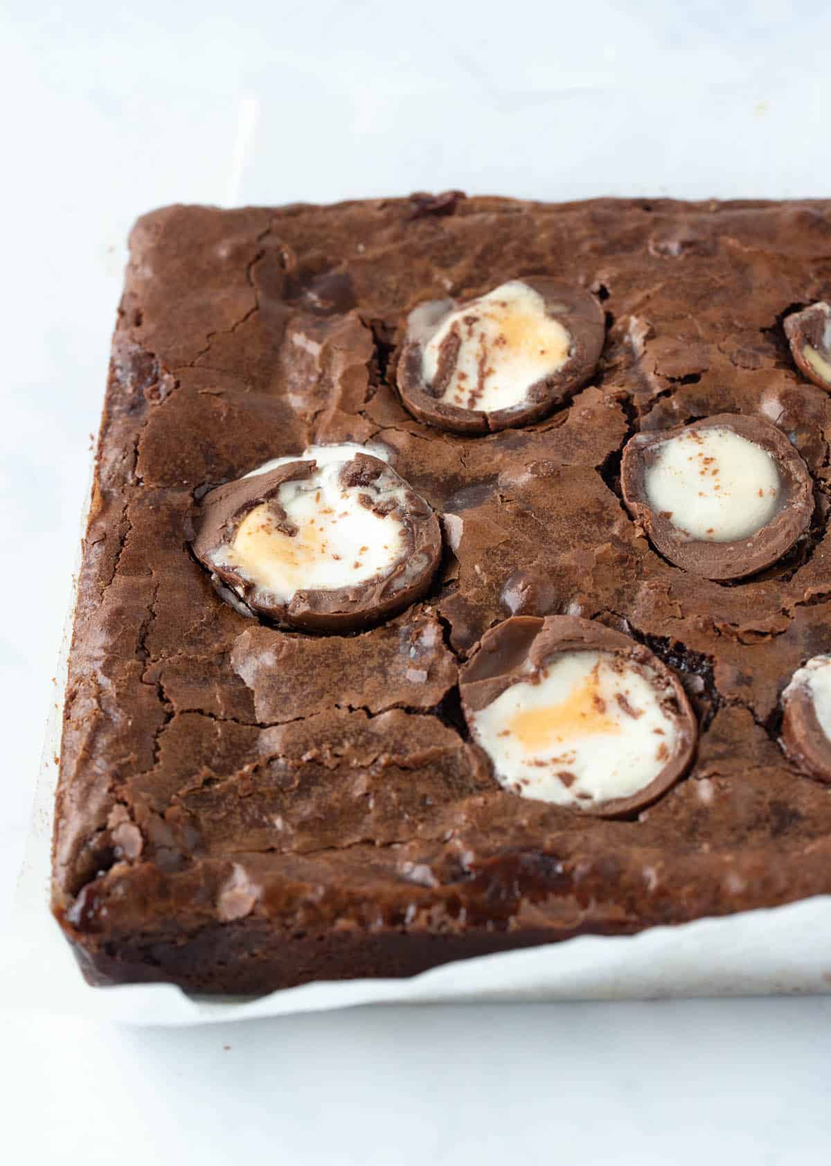 A chocolate brownie topped with Cadbury Creme Eggs.