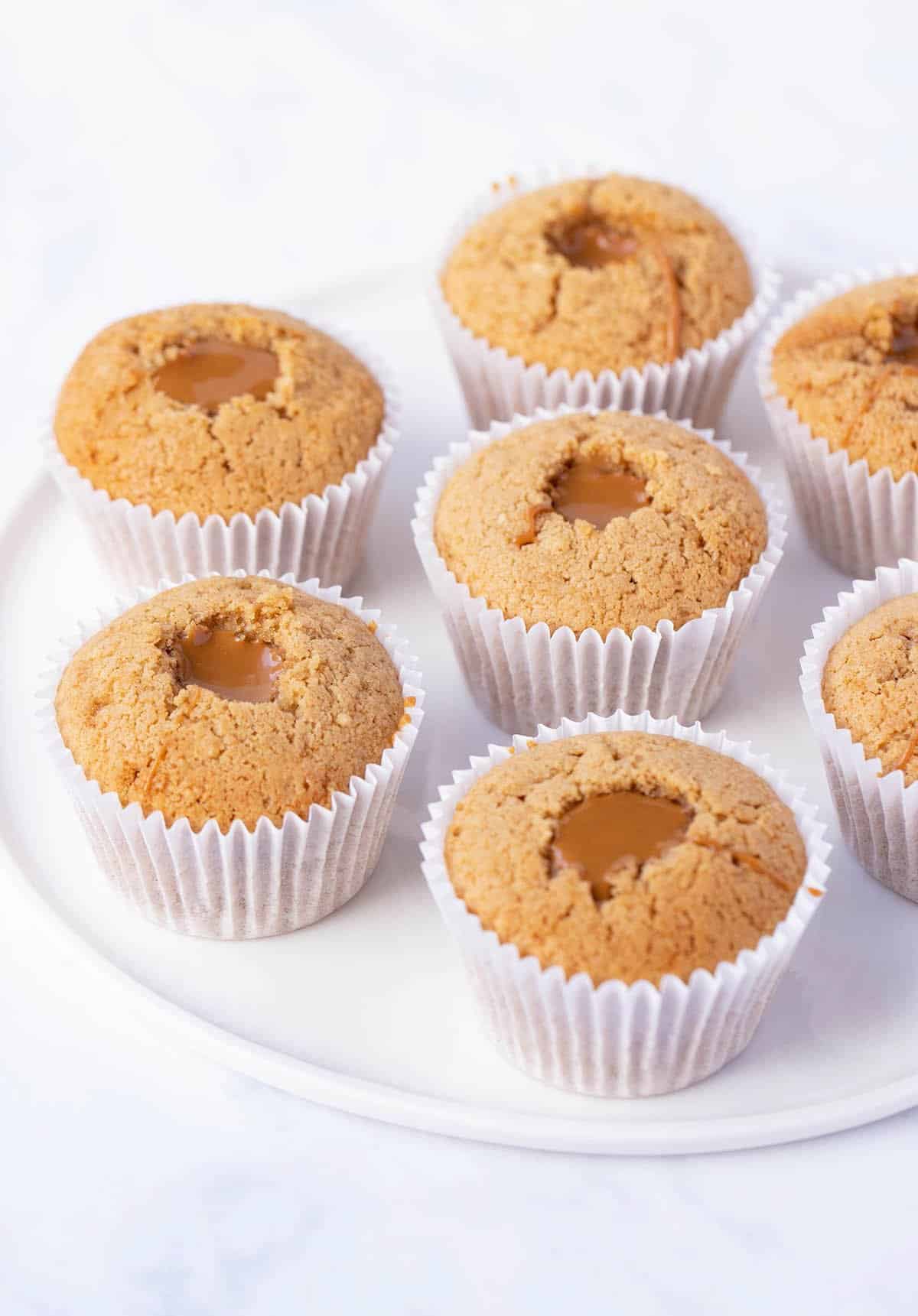A plate of Biscoff Cupcakes filled with Biscoff cookie butter.