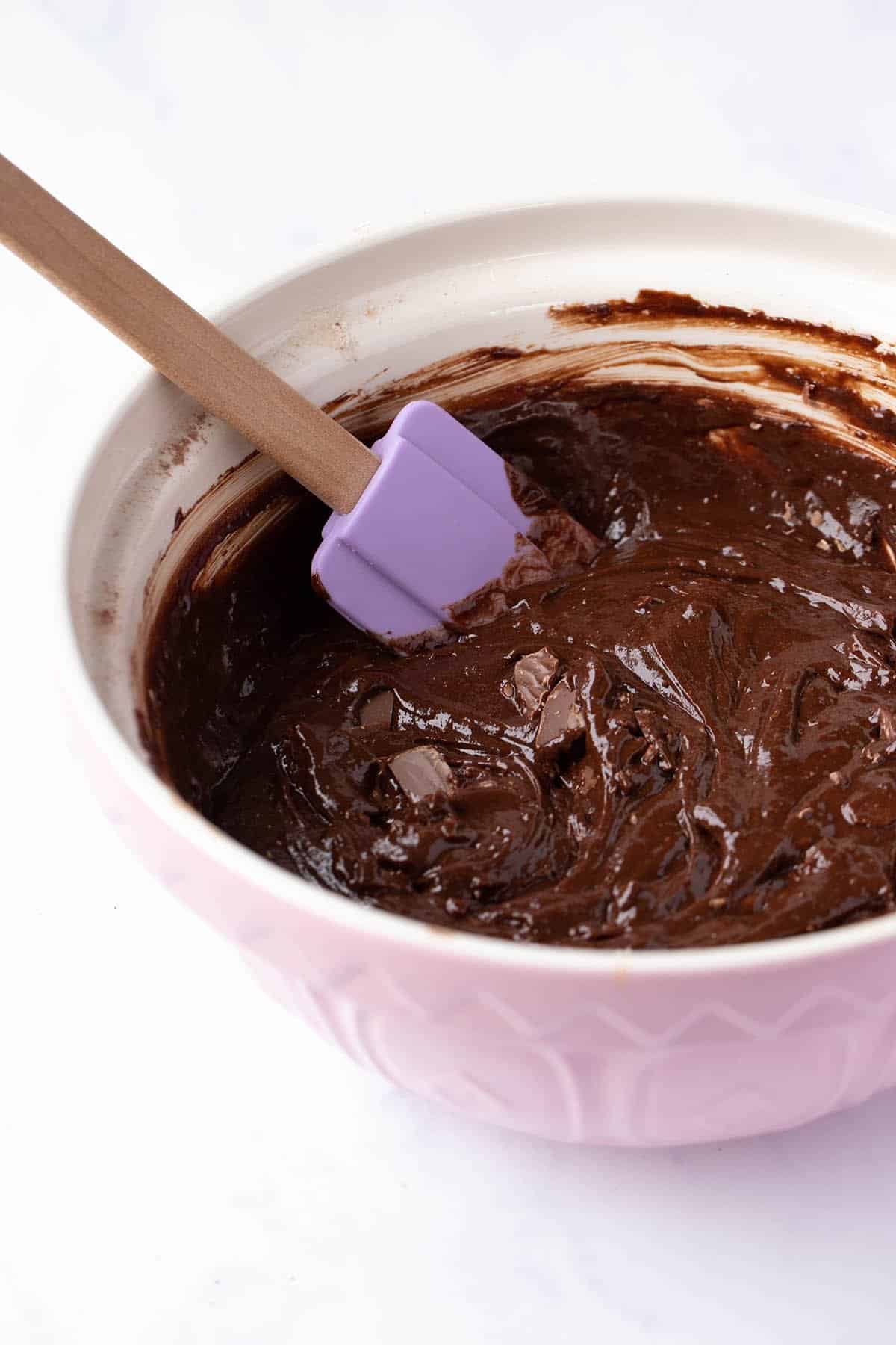 A large mixing bowl filled with chocolate brownie batter.