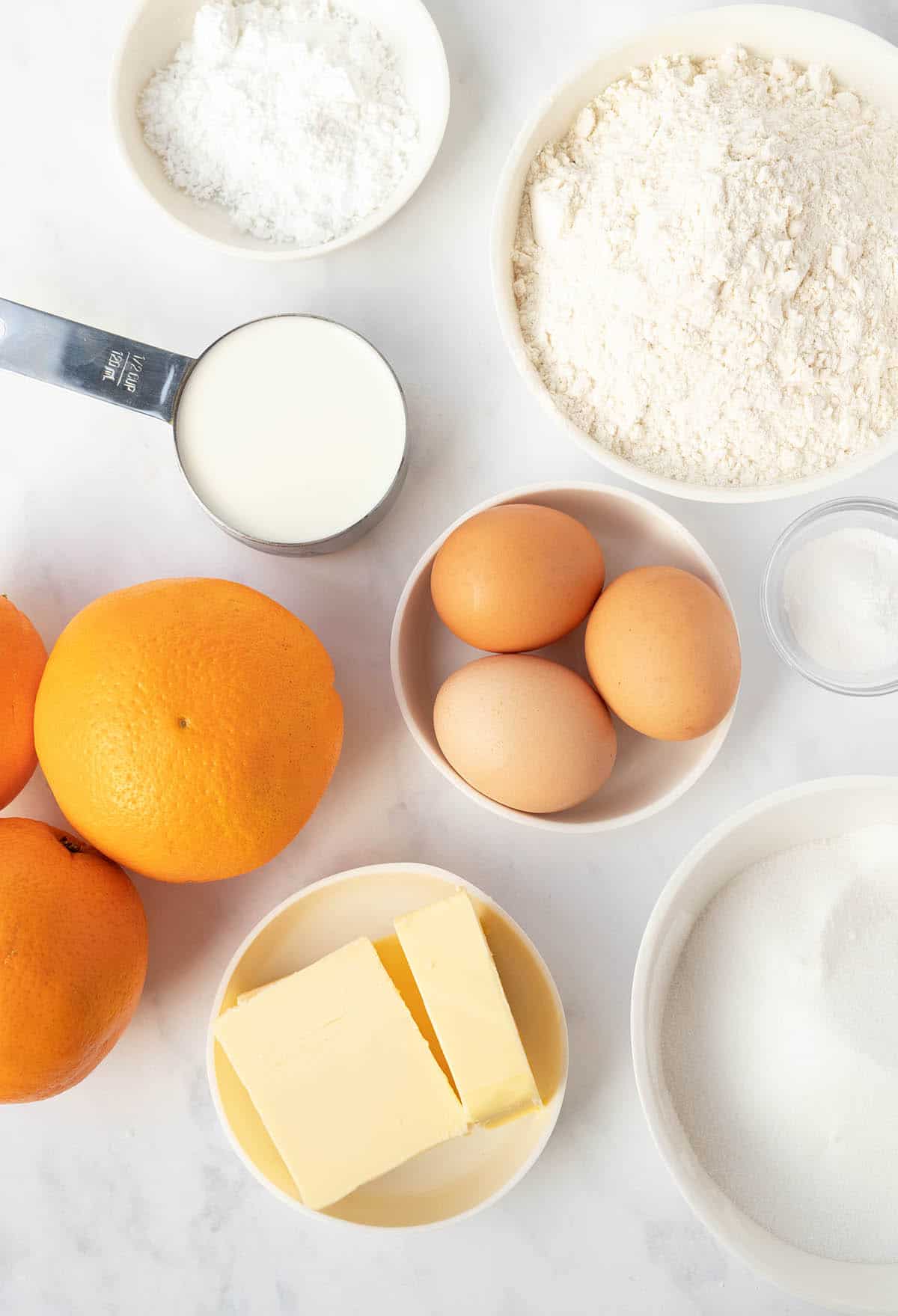 All the ingredients needed to make an Orange Pound Cake laid out. 