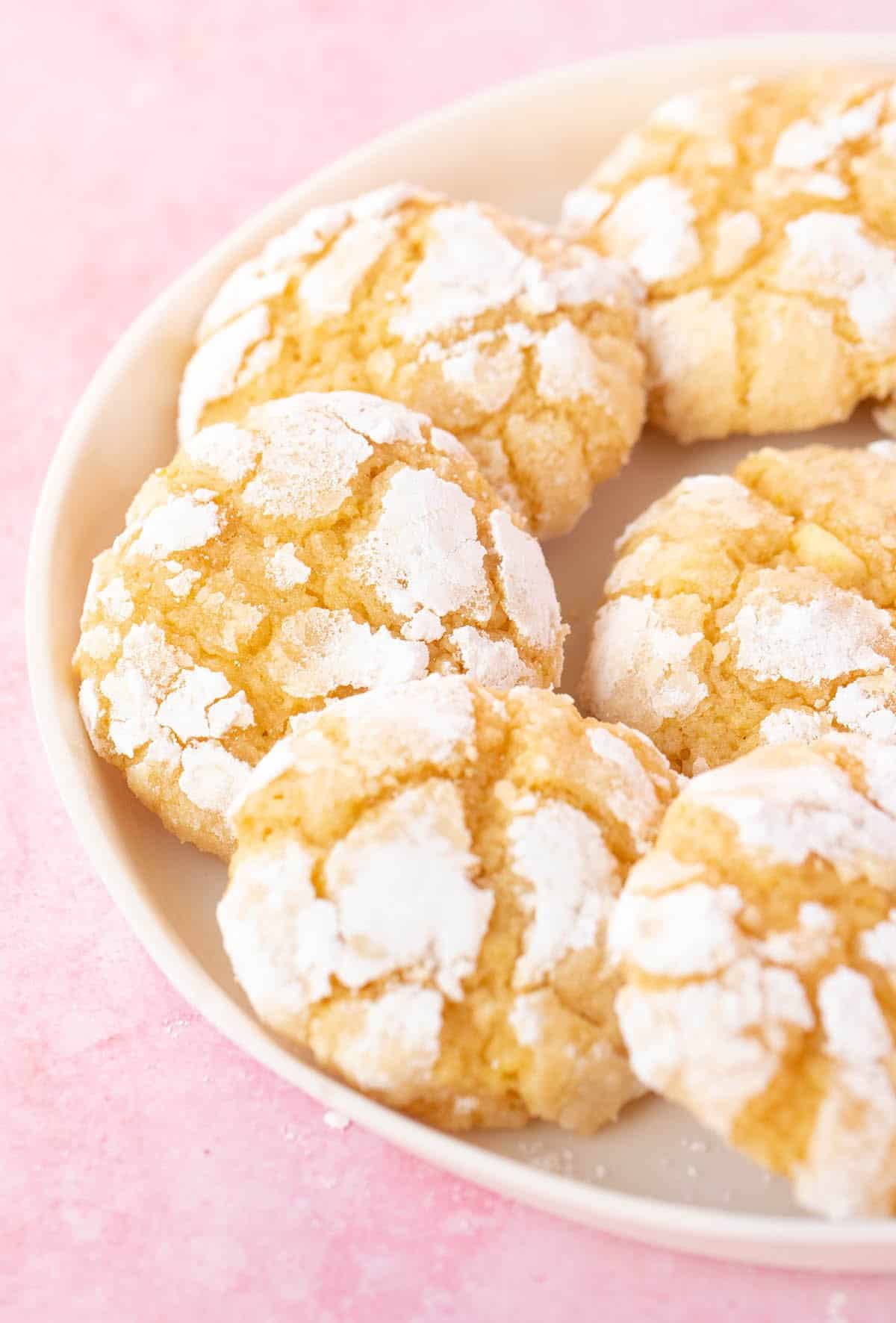 A white plate filled with homemade Lemon Crinkle Cookies 