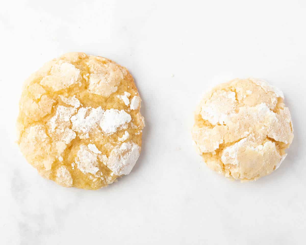 Two cookies side by side showing the difference between baking soda and baking powder.