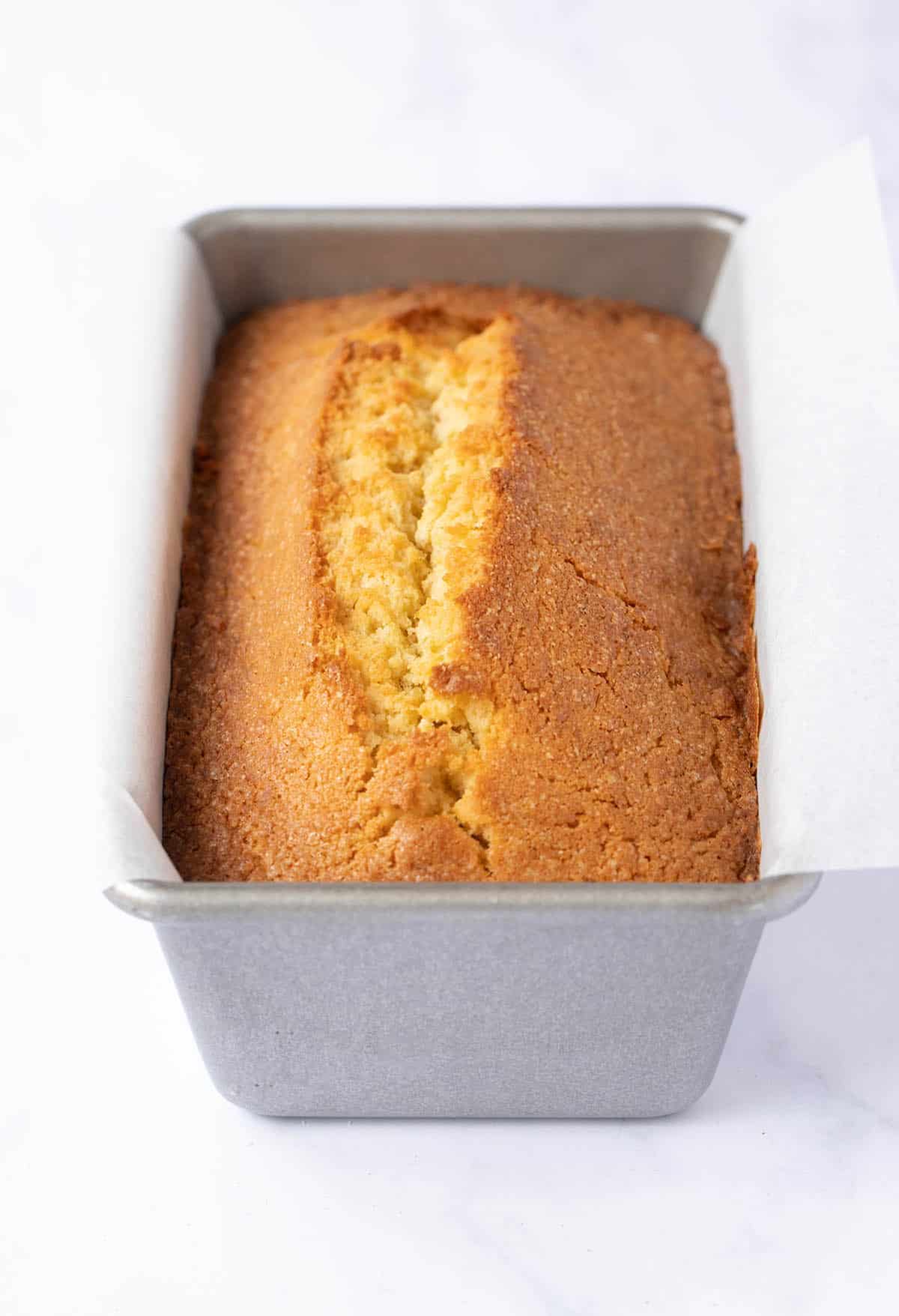 Fresh out of the oven Coconut Pound Cake sitting in cake pan
