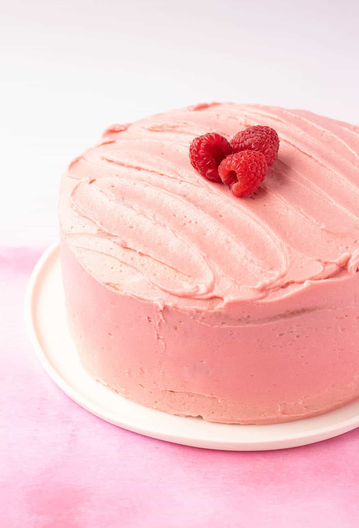 A beautiful layer cake frosted with raspberry buttercream. 