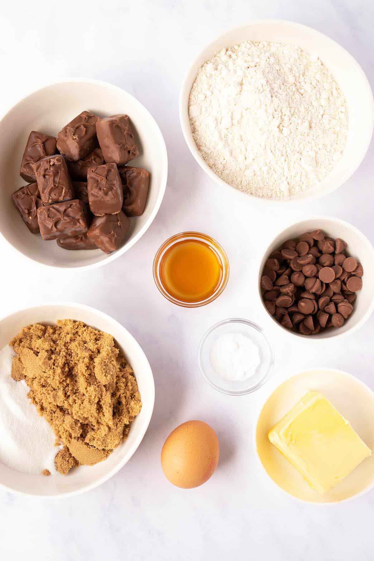 All the ingredients needed to make Snickers Cookies from scratch. 
