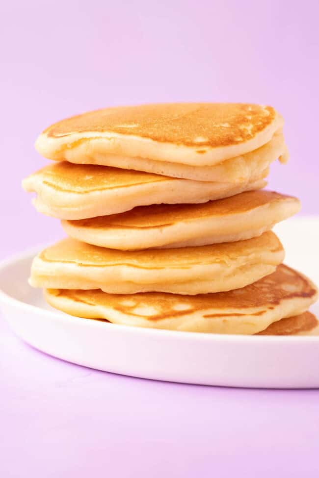 A stack of mini pancakes made from scratch.