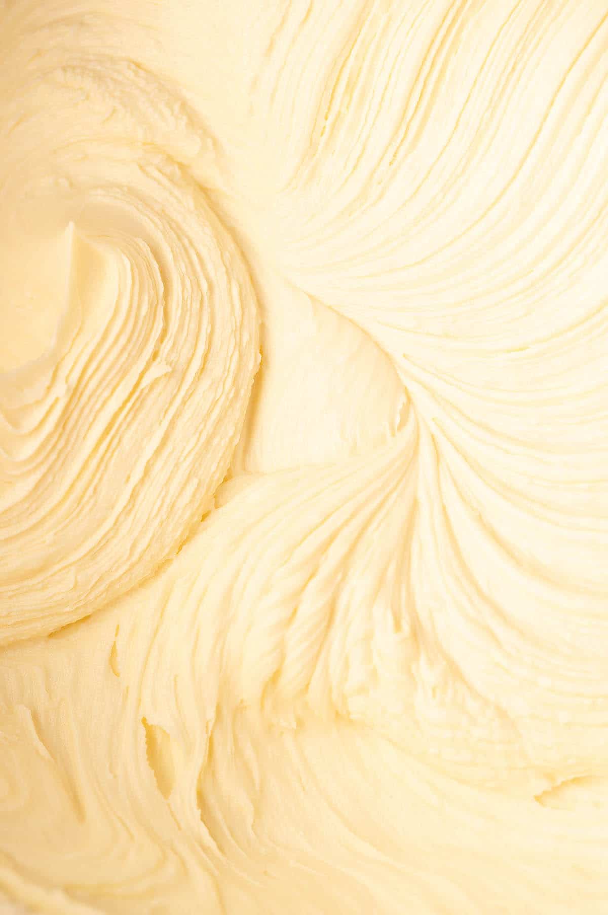Close up of whipped white chocolate frosting.