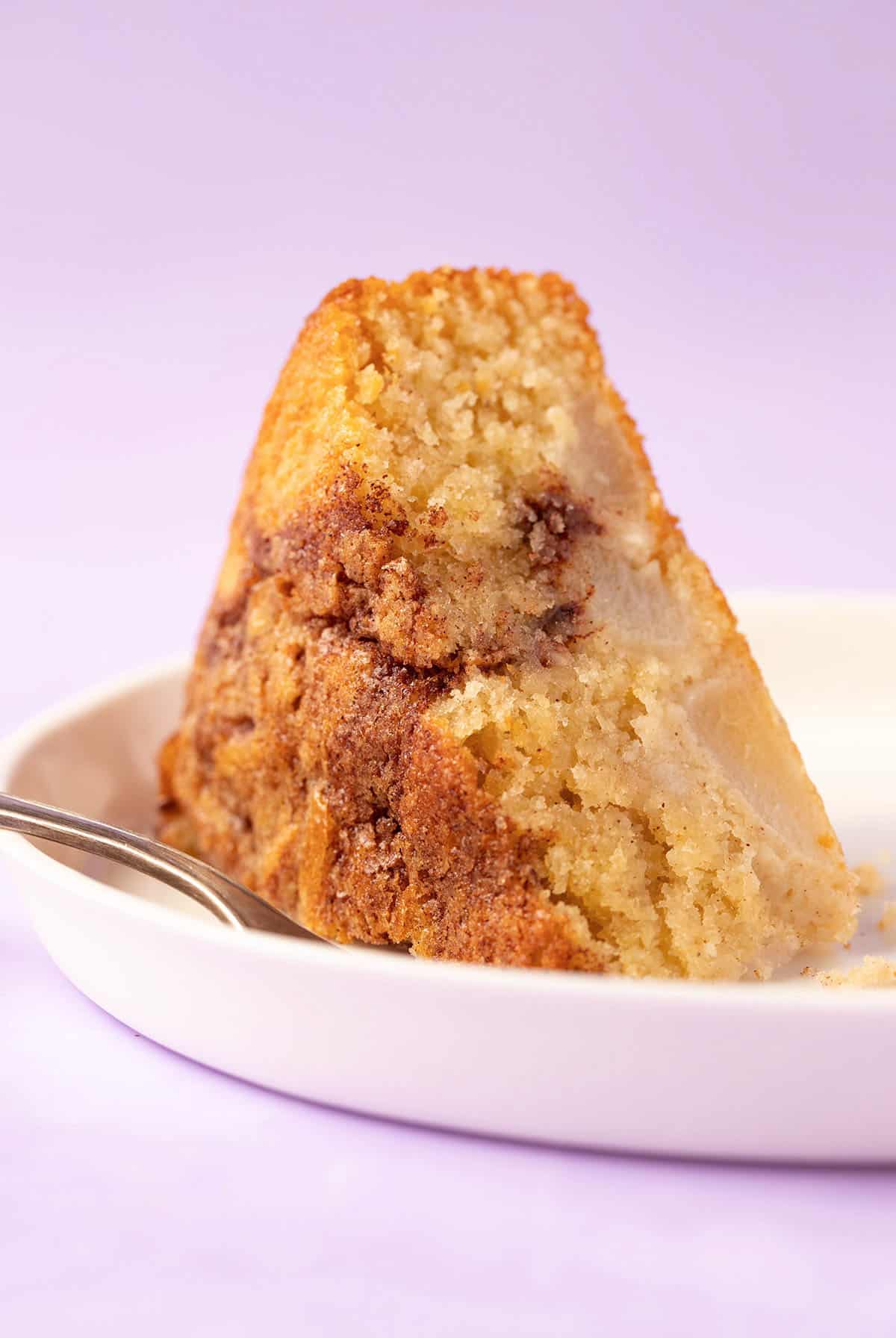 A slice of Pear Cake with a decorative fork. 