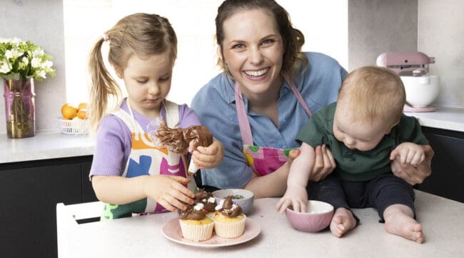 Jessica Holmes and her kids baking in her home kitchen.
