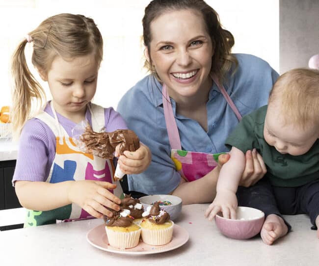 Jessica Holmes and her kids baking in her home kitchen.